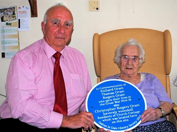 DADDY’S GIRL: Colin Brammer shows 99-year-old Betty Preece, the daughter of Richard Oram, the plaque commemorating the sacrifice of him and his brothers