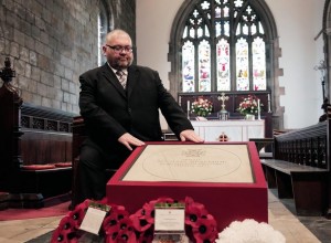 Great-grandson Ian Heaviside with the Michael Heaviside VC memorial stone after the service at St Giles Church in Durham. Picture by Stuart Boulton.