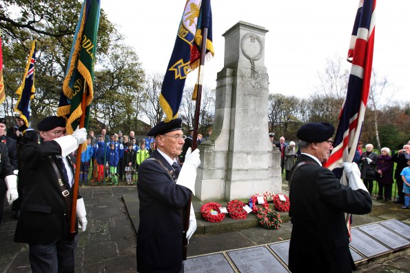 REMEMBRANCE SERVICE: Standard Bearers pass the War Memorial at Smith’s Dock Park, Normanby, during a remembrance service. Picture: TOM BANKS
