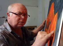 MASTER CLASS: Artist Mackenzie Thorpe at work on the poppy