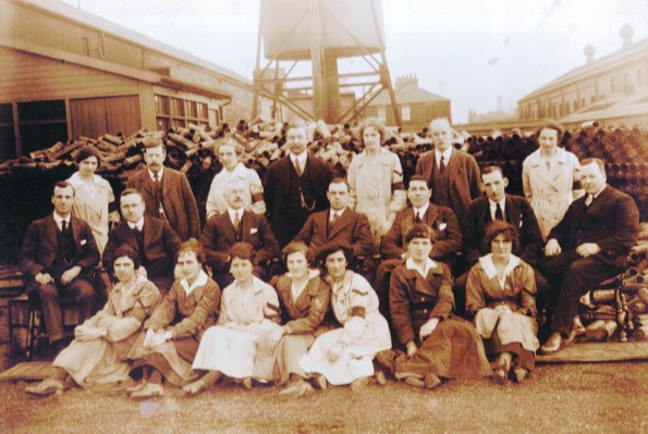 SHELL MAKERS: The senior inspection staff at the North Road shell shop, which was at the Westmoreland Street side of the railway works in Darlington. The men on the chairs clearly have the power over the women at their feet, and note the huge pile of shells behind them. Picture courtesy of Darlington Centre for Local Studies