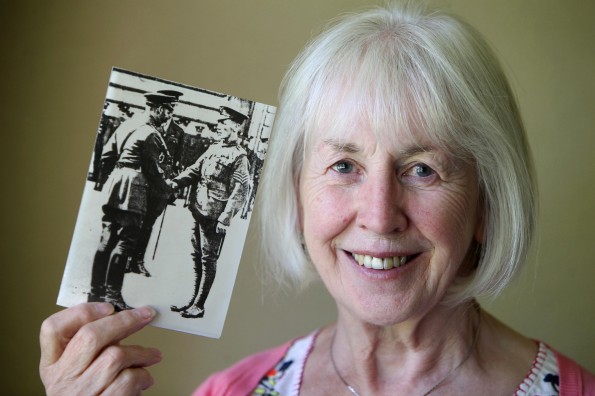 MEDAL WINNER: Sergeant Edward Cooper's granddaughter, Liz Bell, with a photo of him receiving his Victoria Cross