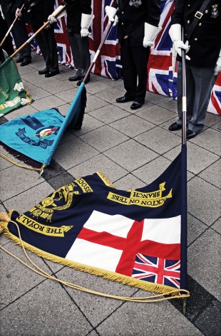 IN REMEMBRANCE: Standard bearers lower their standards during the service in Thornaby town centre. Picture: STUART BOULTON