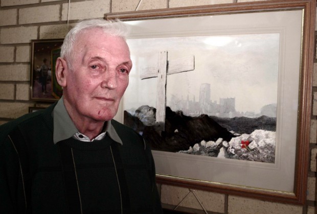 Artist Bob Ord and his painting in memory of soldiers shot at dawn
