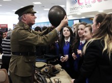 TIME LORD: Tony Hall, of the Time Bandits re-enactment group, and pupils from Thornaby Academy during a First World War event at the town’s central library