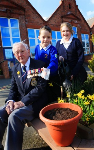 LEST WE FORGET: War veteran Doug Sayles, 94, with Declan Metcalf and Samantha McAllister, both ten