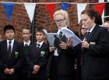 INSPIRATIONAL READINGS: Greenfield Community College pupils read poetry they have written, inspired by the First World War and appearing in a book created by the Aycliffe Village Local History Society. Shannon-Leigh Banks (13) and Rachel Bremner (13) read their untitled poem. Picture: CHRIS BOOTH