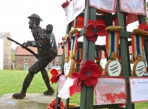 The knitted medals near the wicker sculpture of the WWI soldier at Great Ayton. Picture: RICHARD DOUGHTY PHOTOGRAPHY