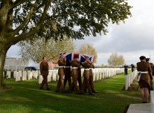 RE-INTERNMENT CEREMONY: Soldiers from 4 YORKS carry the body of an unknown soldier to his final resting place.