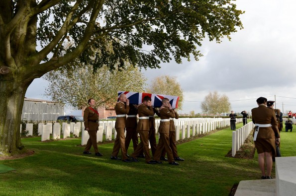 RE-INTERNMENT CEREMONY: Soldiers from 4 YORKS carry the body of an unknown soldier to his final resting place.