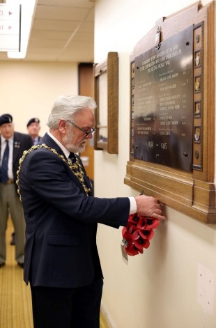 POPPY LAUNCH: Darlington mayor Cllr Gerald Lee lays a poppy wreath by a war memorial plaque at Darlington town hall, at the launch of this year's poppy appeal Picture: CHRIS BOOTH