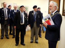 POPPY LAUNCH: Darlington mayor Cllr Gerald Lee addresses members of the Royal British Legion by a war memorial plaque at the Town Hall, at the launch of this year's poppy appeal Picture: CHRIS BOOTH