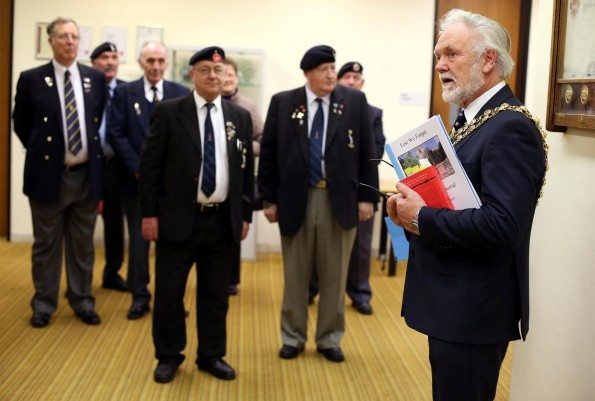 POPPY LAUNCH: Darlington mayor Cllr Gerald Lee addresses members of the Royal British Legion by a war memorial plaque at the Town Hall, at the launch of this year's poppy appeal Picture: CHRIS BOOTH