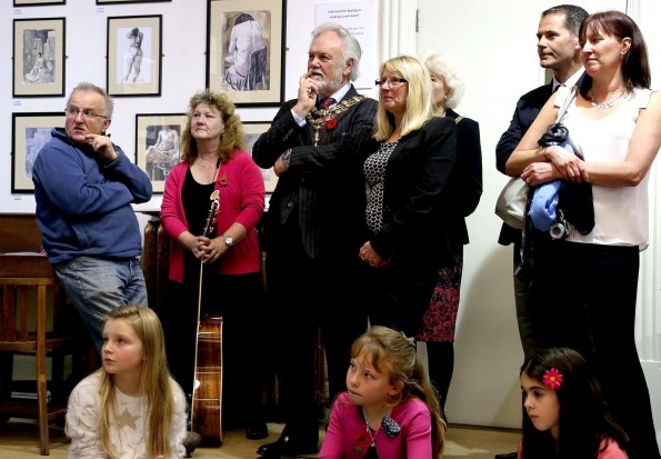 SCHOOLS EXHIBITION: Mayor of Darlington councillor Gerald Lee (center) listens to poems written by school children during the event at the Crown Street Library in Darlington. Picture: DAVID WOOD