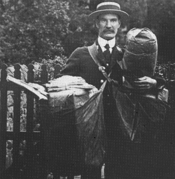 CHEERY: Postman George Thorn with a heavy load to deliver