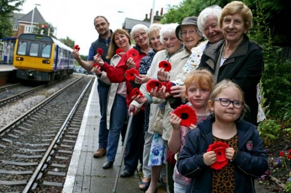 A team of knitters have begun making thousands of poppies to be ready for Armistice Day. They are pictured at Nunthorpe Railway Station in Middlesbrough, fronted by Sophie Marshall (6) and Iris McGlynn (5). Picture: CHRIS BOOTH