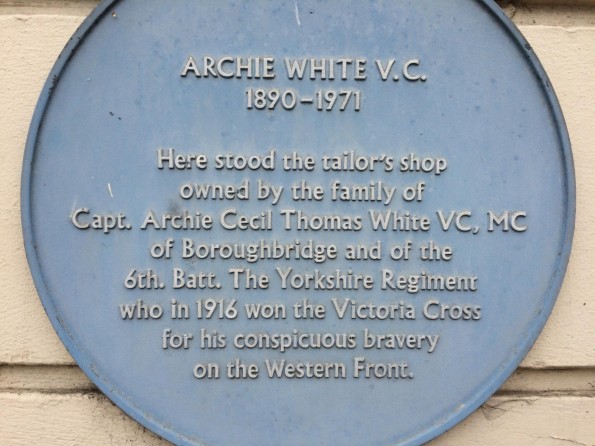 The blue plaque on the premises of Archie White's father's shop