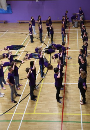 PASSING OUT: Children at St Aidan's Academy in Darlington perform their parade at the end of Make a Difference week