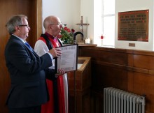 Bishop of Jarrow, Rt Revd Mark Bryant re-dedicates the plaque. Alongside him is server Peter Hakin. Picture: CHRIS BOOTH