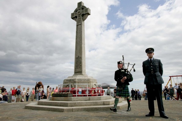 Piper David McKenna plays a lament at the war memorial during the First World War commemoration event in Seaham. Picture: DAVID WOOD 