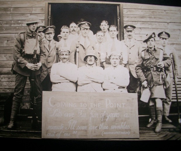 MAKING LIGHT OF IT: A postcard in Tom Stafford’s collection in which soldiers and medical staff are re-enacting a Bairnsfather gag entitled “Coming to the point”. The board in front of this motley collection of medics reads: “Let’s ’ave this pin of yours a minute, I’ll soon ’ave these winkles out of ’ere.” A pin in Bairnsfatherspeak was a bayonet; the winkles were pieces of shrapnel; the result must have been unspeakably painful