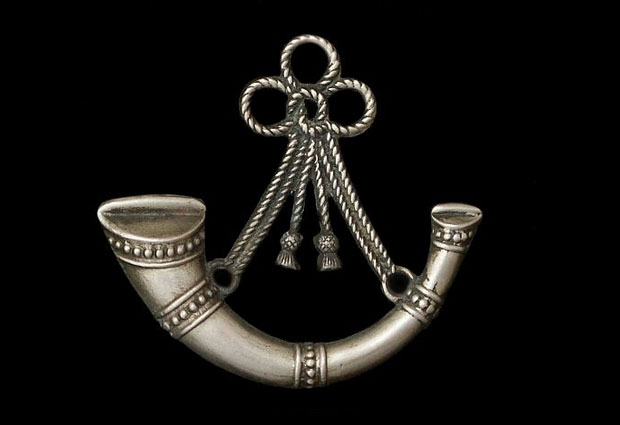 The bugle badge of the Oxfordshire and Buckinghamshire Light Infantry Regiment